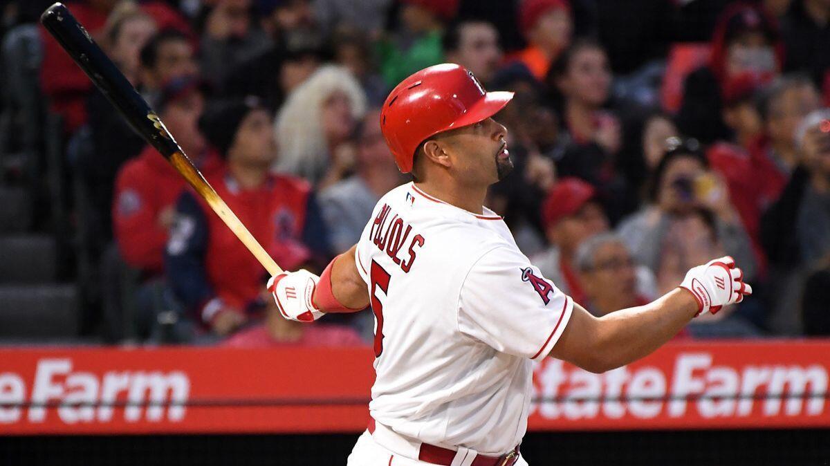 Angels' Albert Pujols hits a solo home run against Baltimore Orioles pitcher Dylan Bundy in the first inning on Tuesday.