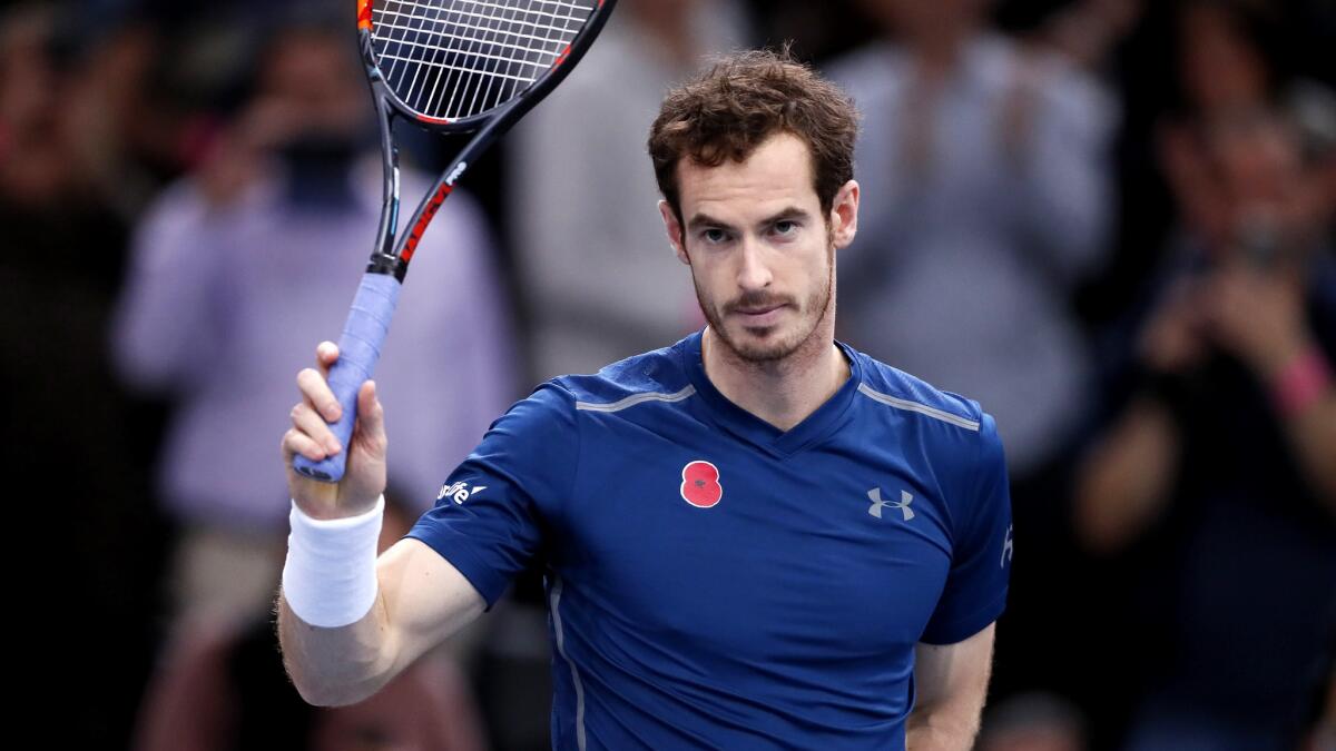 Andy Murray acknowledges the crowd after earning a semifinal win in the Paris Masters by default when Milos Raonic withdrew because of a leg injury.