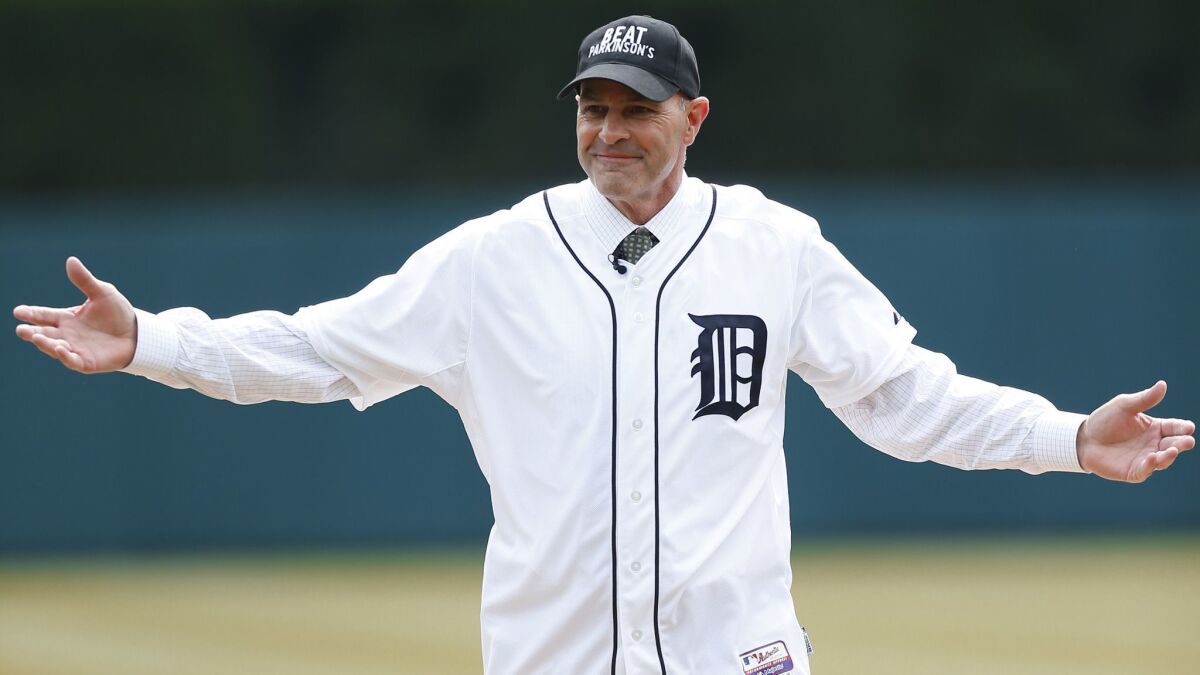 Kirk Gibson reacts after throwing a ceremonial pitch before an opening day baseball game between the New York Yankees and Detroit Tigers on April 8, 2016, in Detroit.