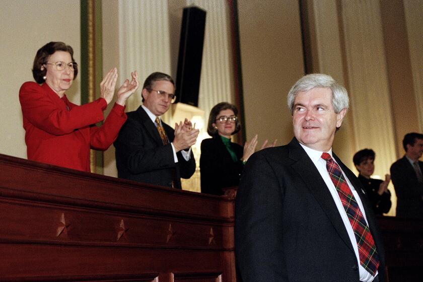 Future House Speaker Newt Gingrich of Georgia looks over his shoulder as he arrives for a Capitol Hill news conference, Monday, Dec. 5, 1994 in Washington, after his fellow Republicans voted him as speaker. To serve alongside Gingrich, the Republicans voted Rep. Dick Armey, R-Texas, as House Majority Leader and Rep. Tom DeLay, R-Texas, as House Majority Whip. (AP Photo/John Duricka)