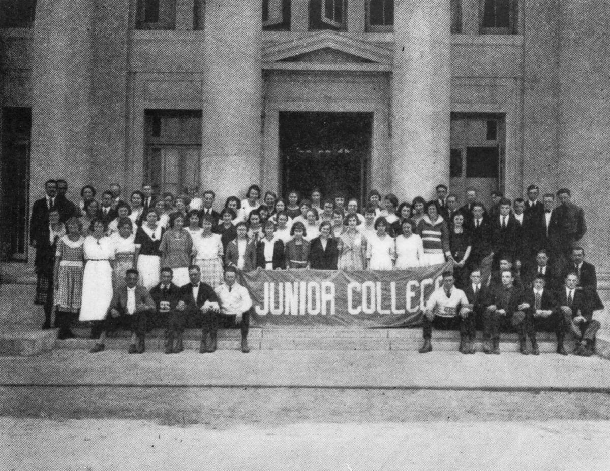 The 1920 graduating class in front of Santa Ana High School, where the college was located at the time.
