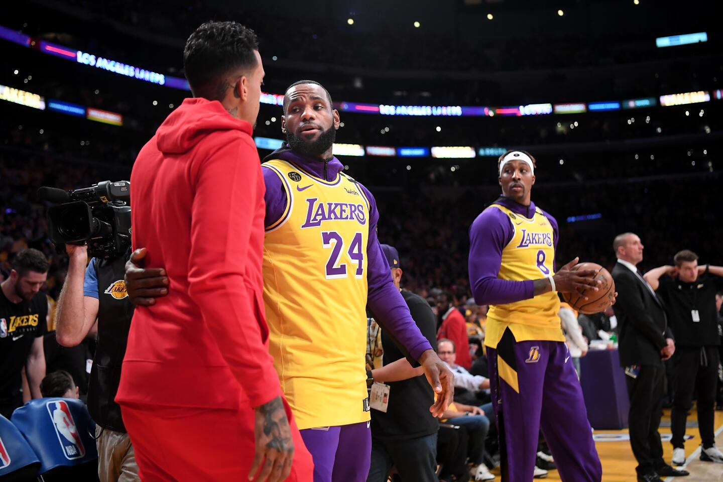 LeBron James greets Matt Barnes before a Lakers game against the Trail Blazers on Jan. 31 at Staples Center.