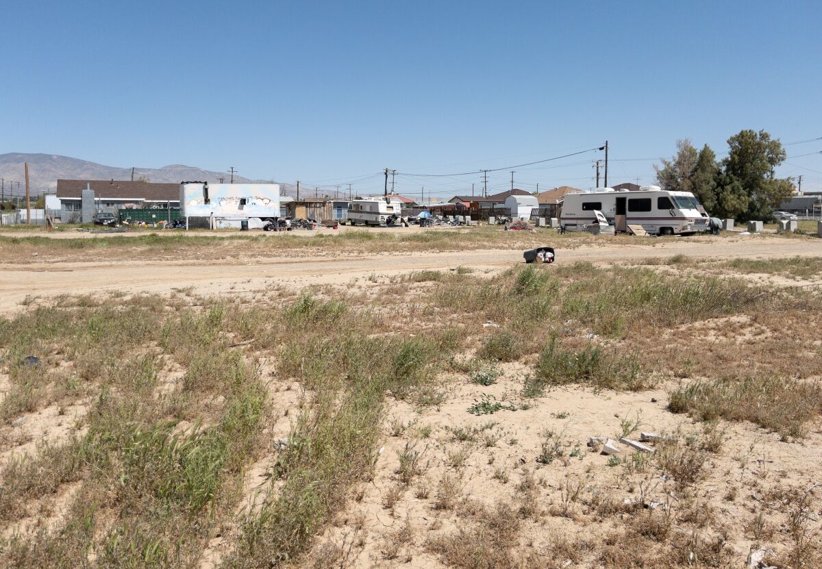 Four people were shot to death in a recreational vehicle on this property in Mojave.