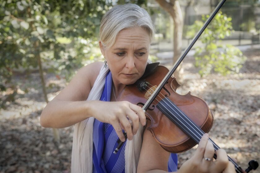 SAN DIEGO, CA - OCTOBER 28: Violinist Healy Henderson performs at UCSD outside the La Jolla Playhouse on Wednesday, Oct. 28, 2020 in San Diego, CA. (Eduardo Contreras / The San Diego Union-Tribune)