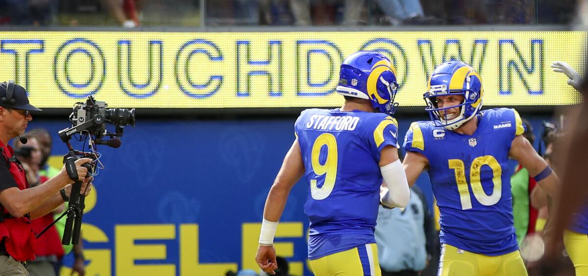 Rams quarterback Matthew Stafford congratulates Cooper Kupp for his touchdown catch.