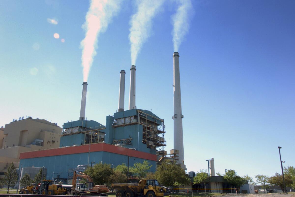Smoke rises from the Colstrip Steam Electric Station, a coal burning power plant in Colstrip, Mont., in 2013.