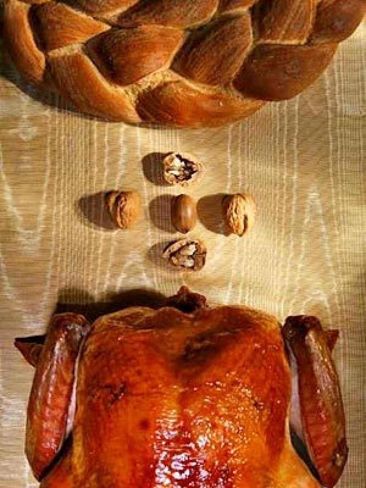A glistening turkey with crisp, bronzed skin is the centerpiece of the feast; the wheat-brown wreath of braided breads  one seasoned with rosemary, the other spiked with pepper  surprises and delights.
