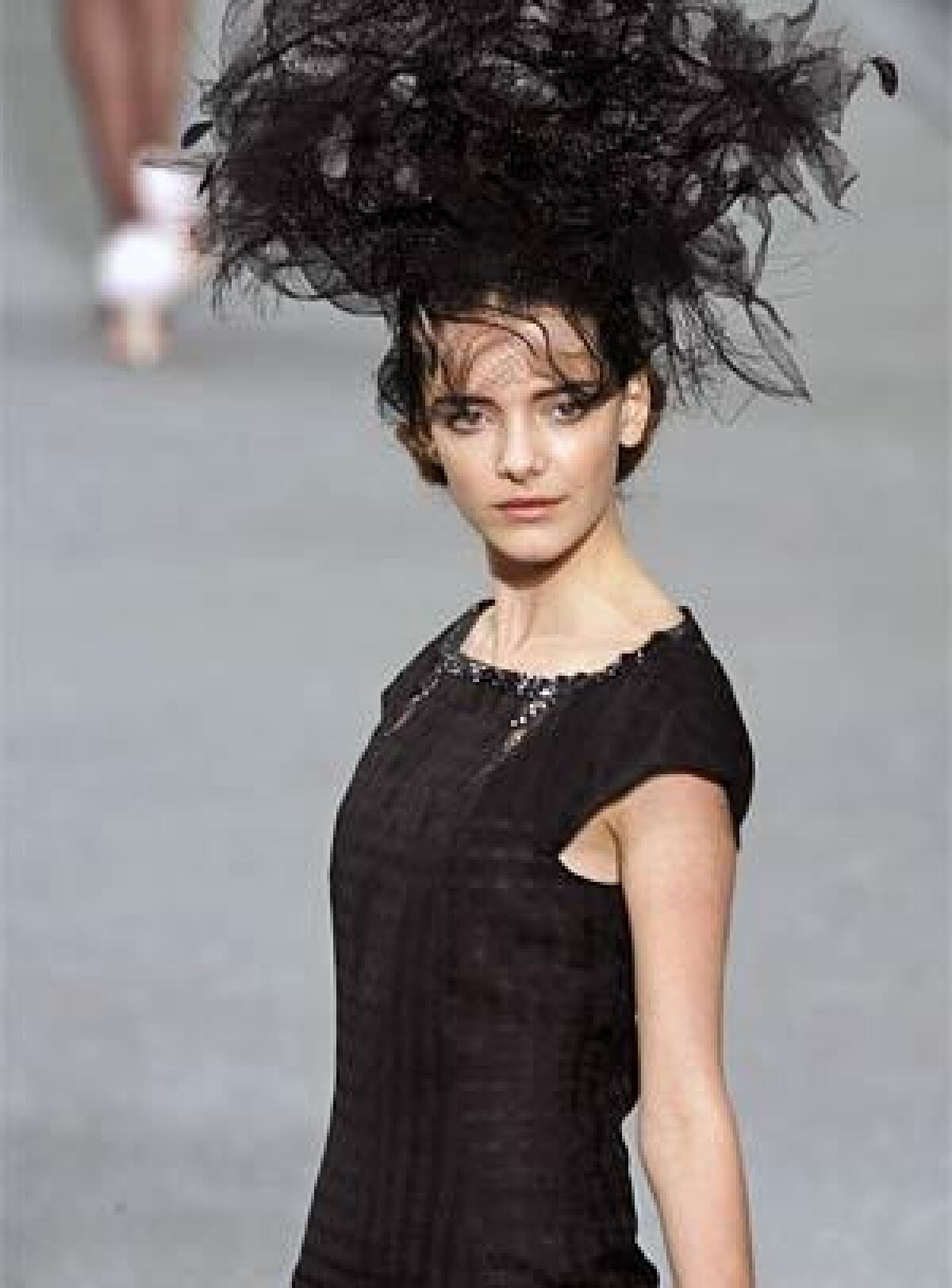 A model dawns an outfit from Chanels Spring 2009 collection at La Mode de France.