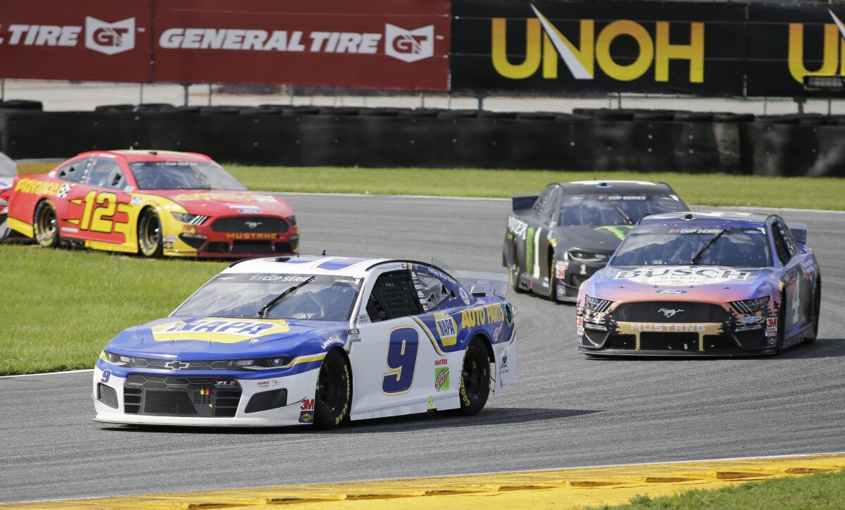 Chase Elliott, front, leads Kevin Harvick, Kurt Busch and Ryan Blaney through Turn 3.
