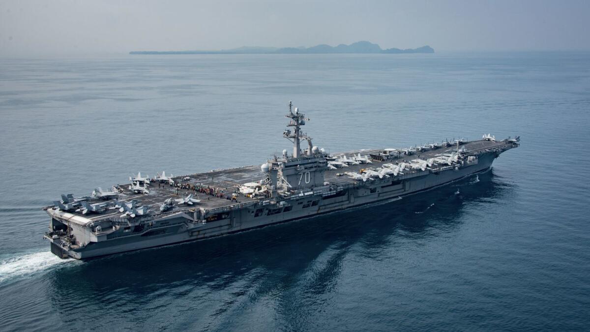 In this photo provided by the U.S. Navy, the aircraft carrier Carl Vinson transits the Sunda Strait on April 14, 2017, in Indonesia.