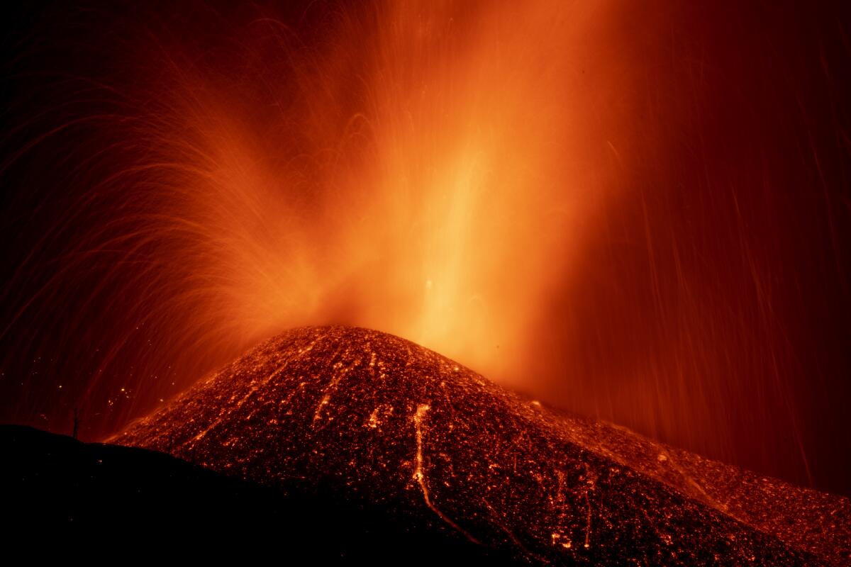 Lava from a volcano eruption flows on the island of La Palma