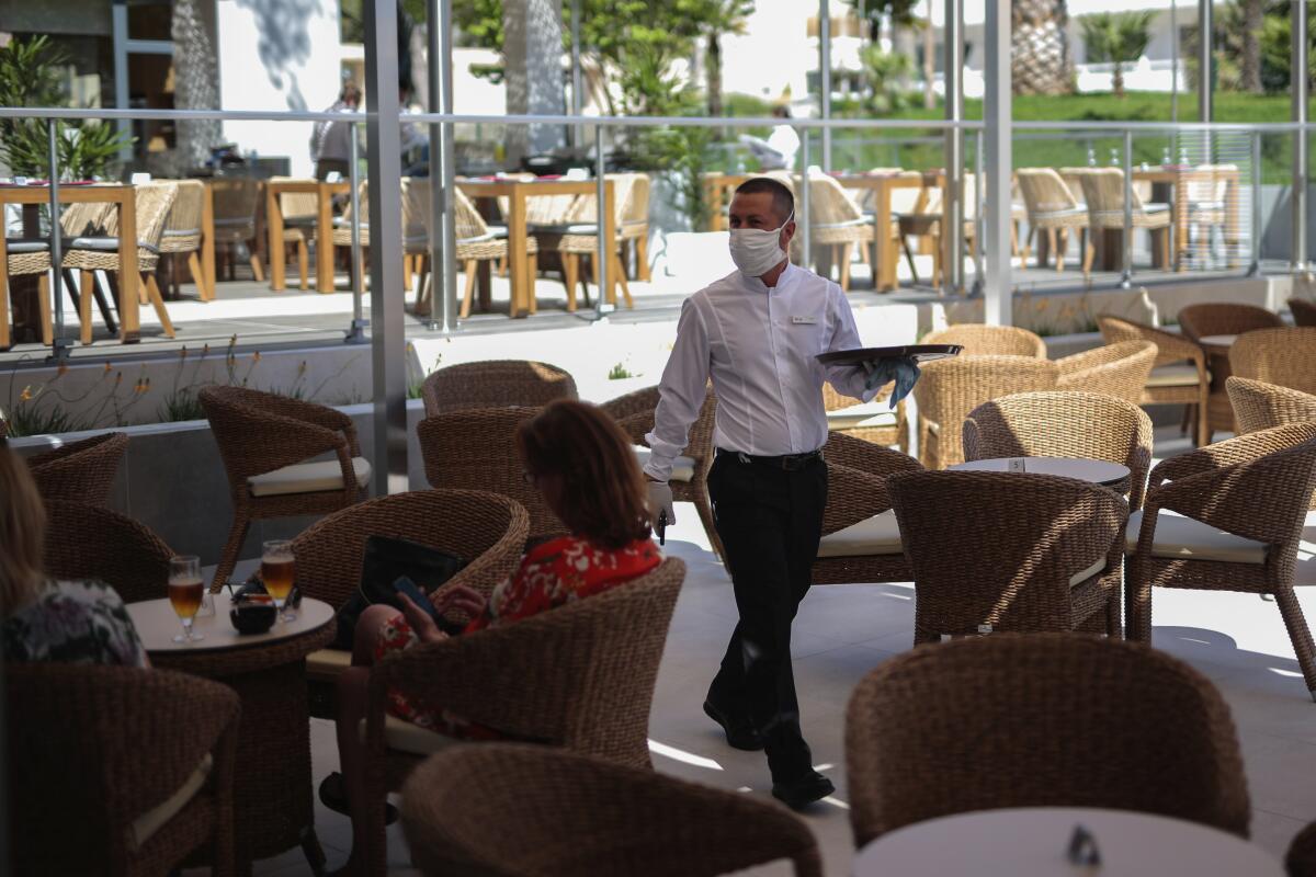 A waiter wearing protective face masks in Palma de Mallorca, Spain.