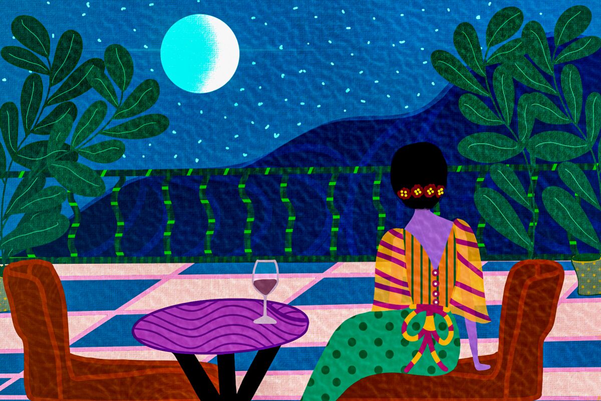 A woman sitting alone looks into the night for her date.