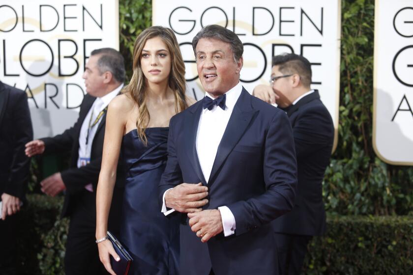 Sylvester Stallone with his daughter on the red carpet at the 73rd Golden Globe Awards.