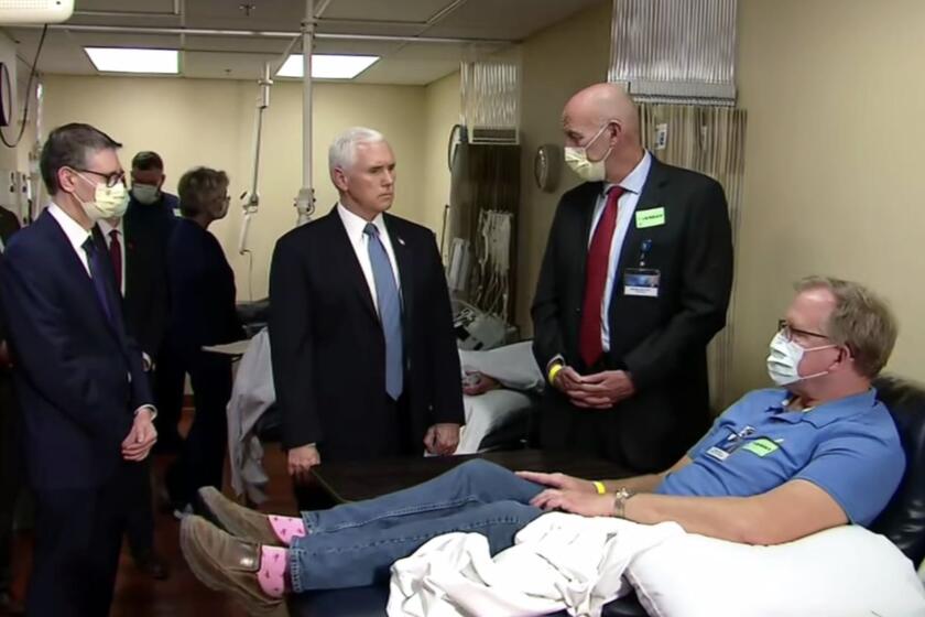 Vice President Pence meets with staff and a patient at the Mayo Clinic. You might notice he's the only one not wearing a mask.