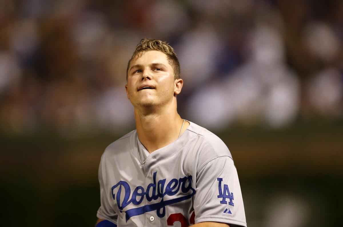 Dodgers outfielder Joc Pederson looks into the stands at Wrigley Field after hitting into a double play to end the top of the sixth inning Monday against the Chicago Cubs.