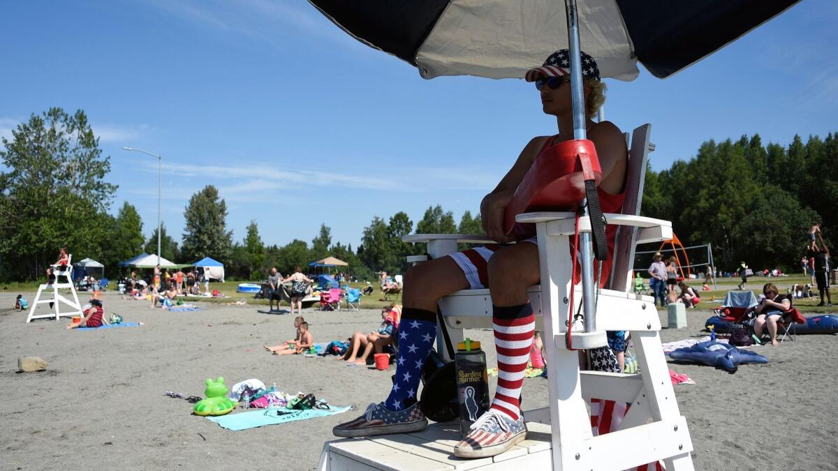 Lifeguard Luke Orot on duty at Jewel Lake in Anchorage.