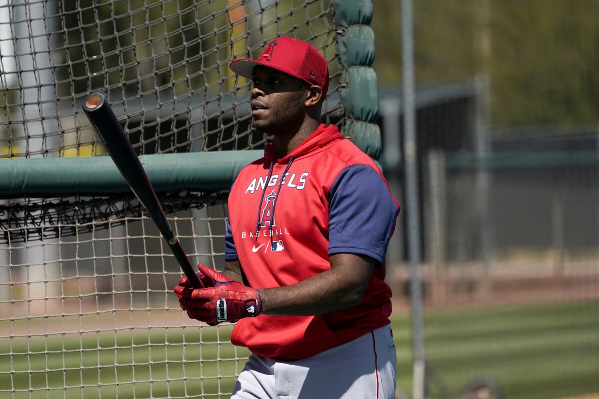 Los Angeles Angels' Justin Upton waits to hit during the teams' spring training baseball workouts, Monday, March 14, 2022, in Tempe, Ariz. (AP Photo/Matt York)