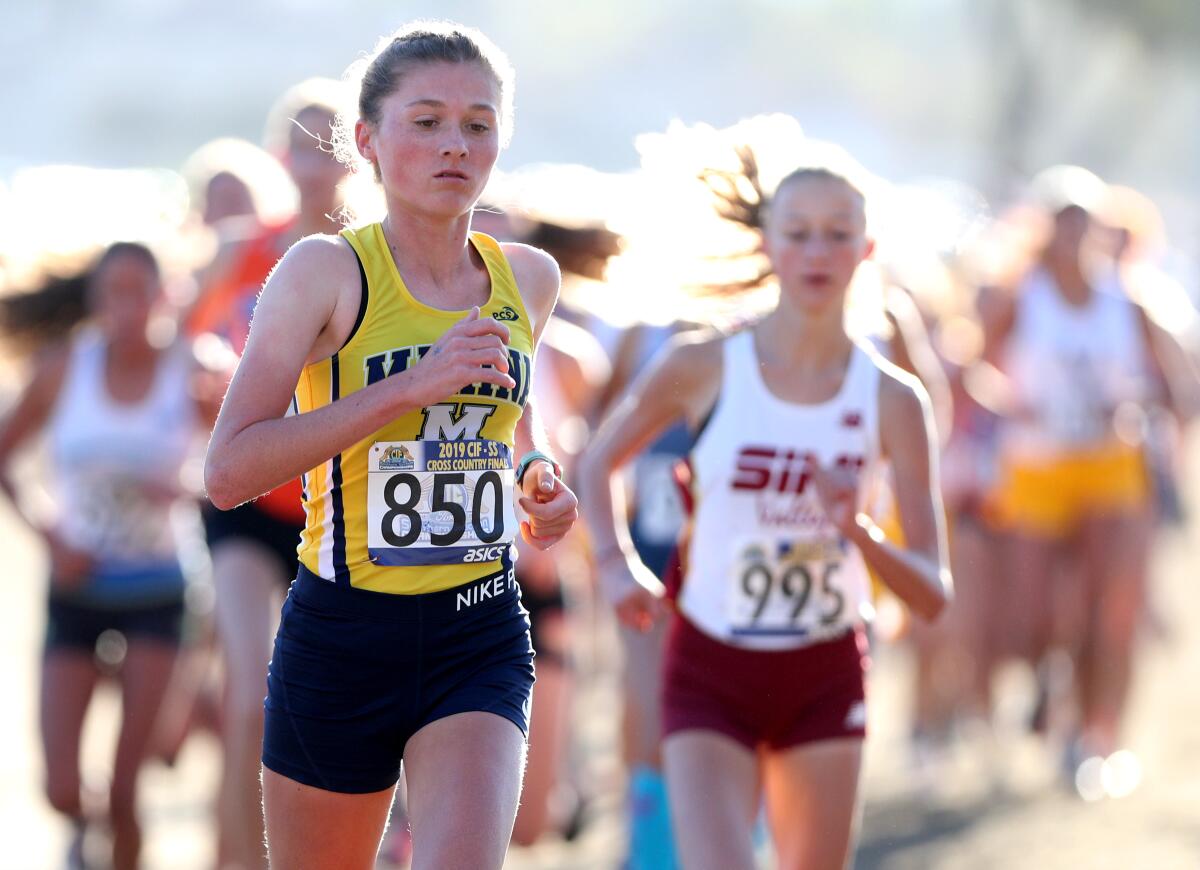 Marina junior Marikay Schwab runs in the girls' Division 2 CIF Southern Section Cross-Country Finals