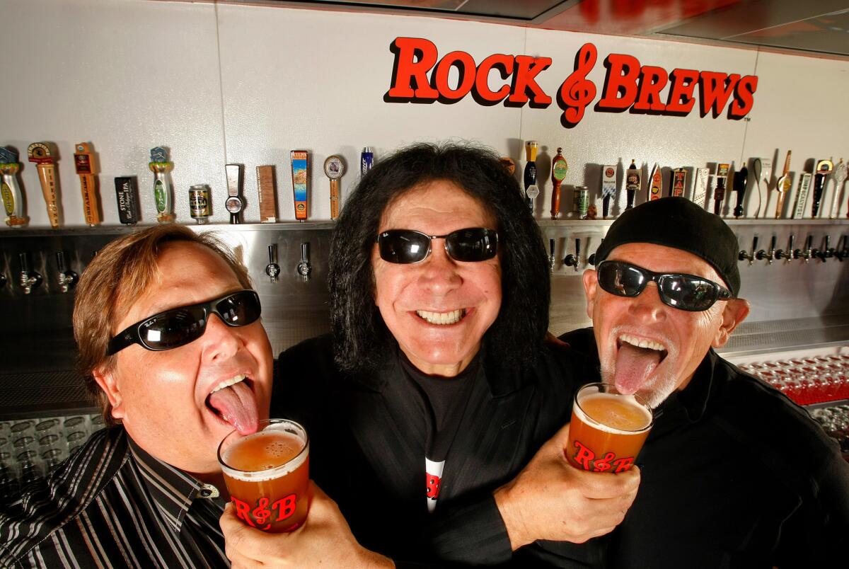 Gene Simmons, center, with his Rock & Brews partners Michael Zislis, left, and Dave Furano.