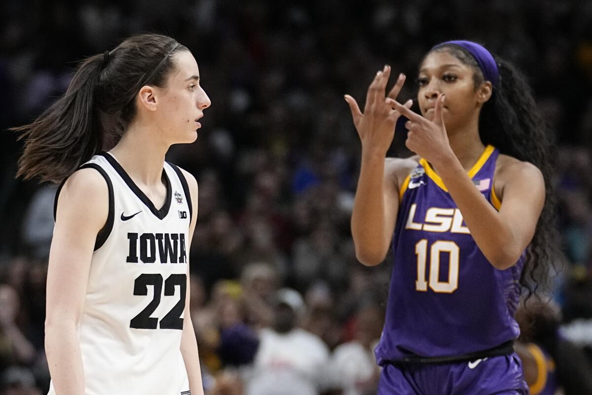 LSU's Angel Reese (10) and Iowa's Caitlin Clark (22) during the NCAA Women's championship game.
