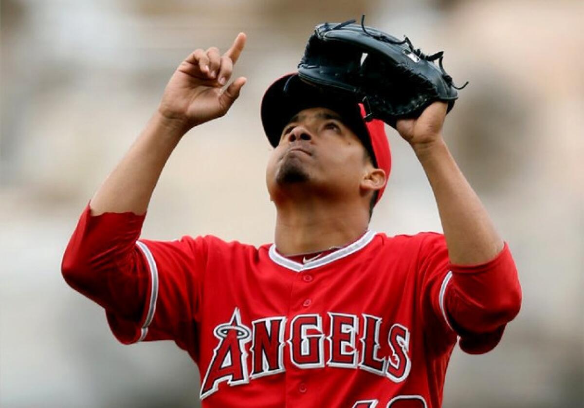 Angels closer Ernesto Frieri points skyward after earning a save against the Houston Astros.