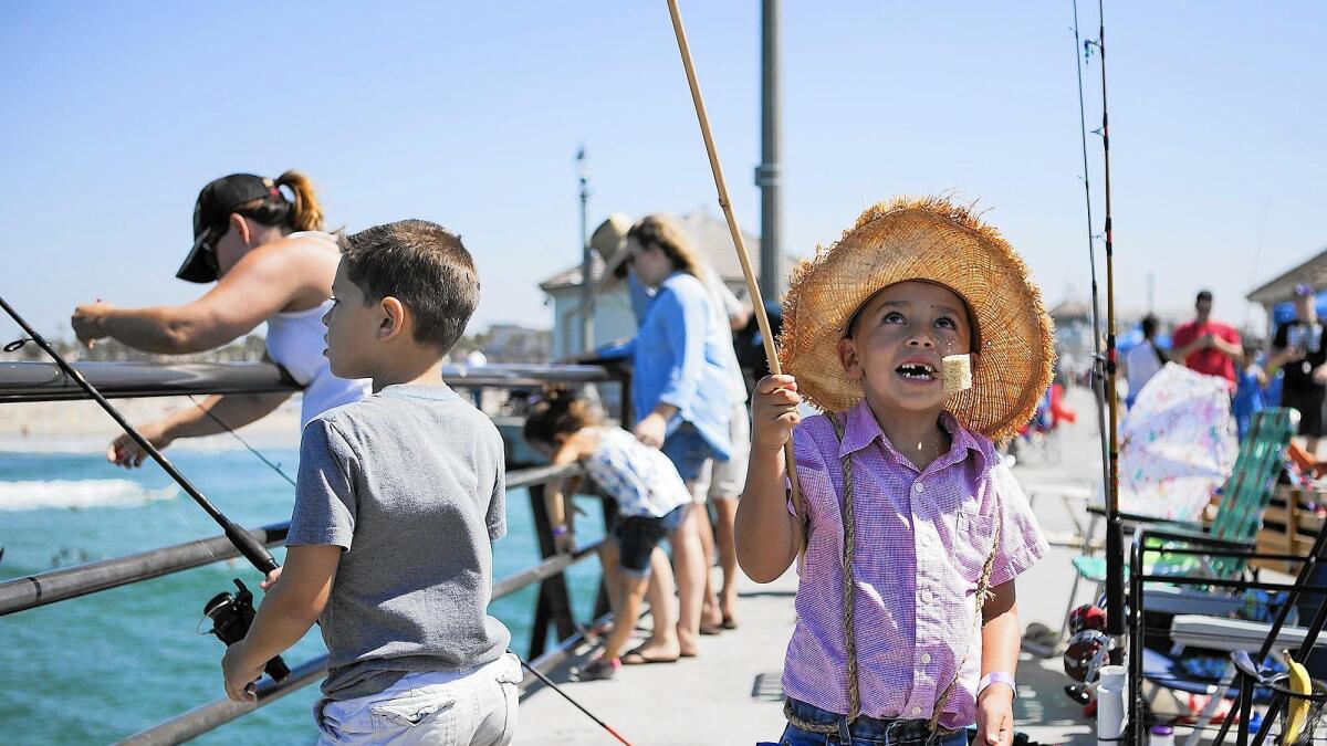 Kids take part in Huck Finn Fishing Derby at H.B. Pier - Los Angeles Times