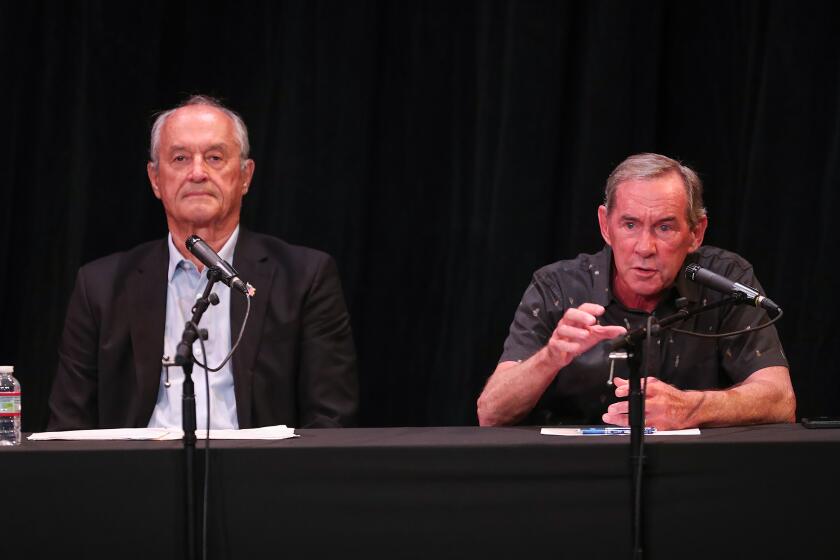 Candidate George Weiss and Bob Whalen participate in the City Council candidates forum, hosted by the Arts Alliance at the Forum Theater on the Festival of Arts grounds in Laguna Beach on Saturday.