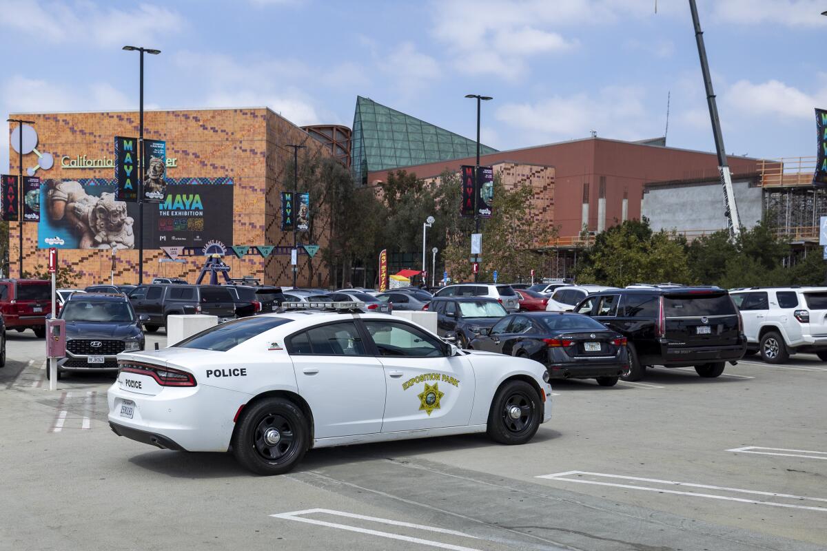 Los Angeles, CA - September 14: Exposition Park police patrol through the parking lot next to the California Science Center in Exposition Park in Los Angeles Thursday, Sept. 14, 2023. (Allen J. Schaben / Los Angeles Times)
