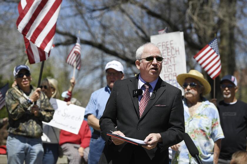 John Eastman speaks about his plans to sue the university at a news conference outside of CU Boulder in April 2021.