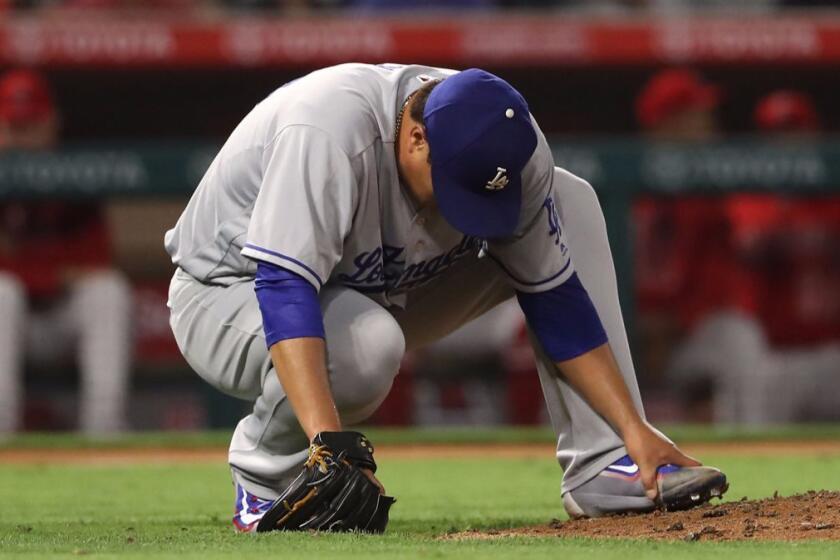 ANAHEIM, CA - JUNE 28: Pitcher Hyun-Jin Ryu #99 of the Los Angeles Dodgers holds his left foot after taking a ball off of it in the fifth inning during the MLB game against the Los Angeles Angels of Anaheim at Angel Stadium of Anaheim on June 28, 2017 in Anaheim, California. (Photo by Victor Decolongon/Getty Images) ** OUTS - ELSENT, FPG, CM - OUTS * NM, PH, VA if sourced by CT, LA or MoD **