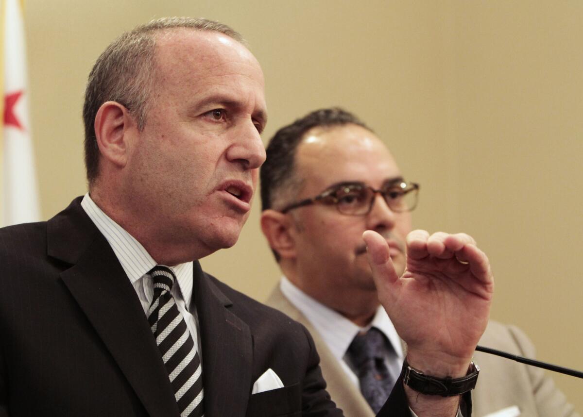 State Sen. President Pro Tem Darrell Steinberg (D-Sacramento), left, discusses the state budget during a news conference with Assembly Speaker John Perez (D-Los Angeles) at the Capitol.