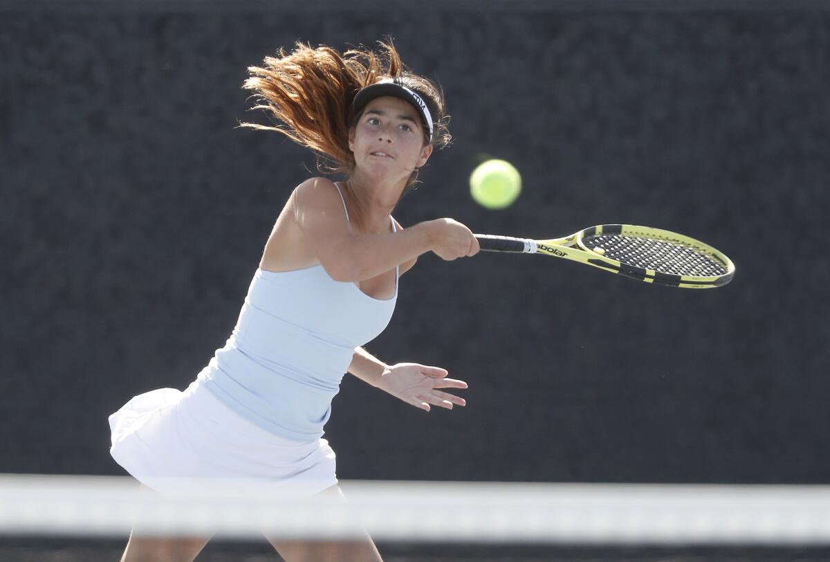 Corona del Mar's Hannah Jervis returns a volley against Fountain Valley's Nghi Trinh in the singles semifinals of the Surf League tournament in Newport Beach on Wednesday.