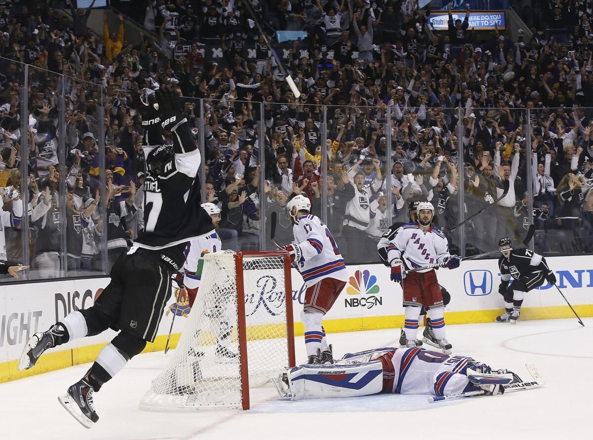 Kings defenseman Alec Martinez leaps off the ice after beating Rangers goaltender Henrik Lundqvist with a shot to end Game 5 of the Stanley Cup Final in double overtime, 3-2, at Staples Center.