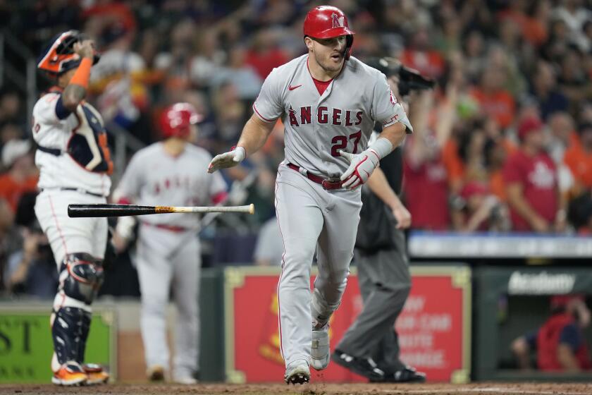 The Angels' Mike Trout leaves the batter's box after hitting a three-run home run during the second inning Sept. 10, 2022.