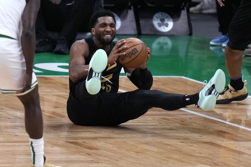 Cleveland Cavaliers guard Donovan Mitchell looks to pass the ball during the first half of Game 1 of the team's NBA basketball second-round playoff series against the Boston Celtics, Tuesday, May 7, 2024, in Boston. (AP Photo/Charles Krupa)