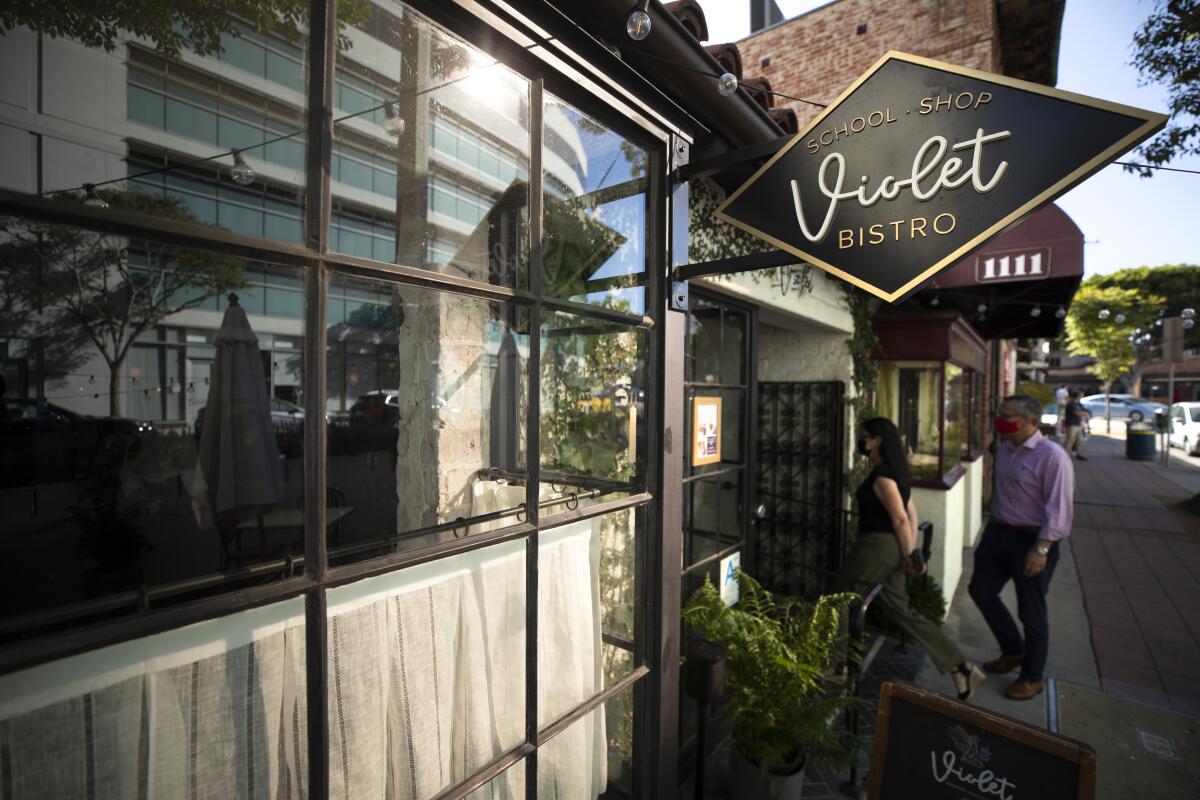 People enter Violet, a Westwood restaurant and cooking school.