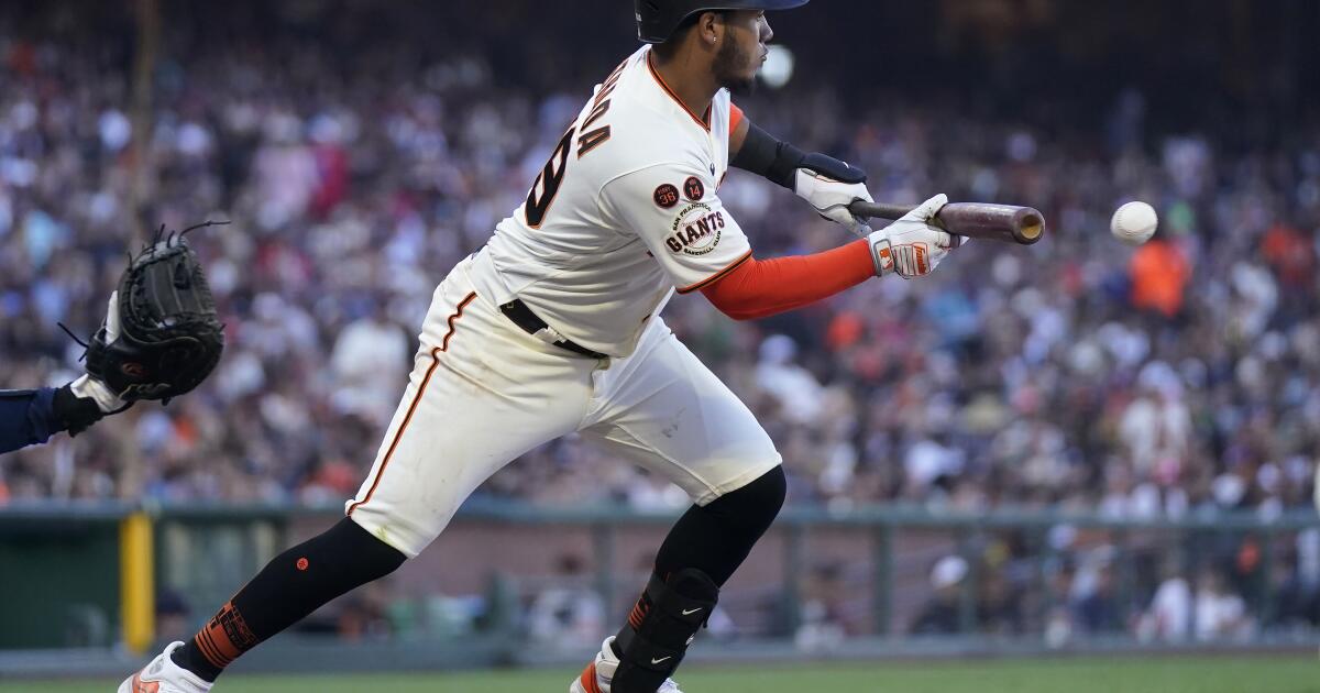 San Francisco Giants Barry Bonds hits one of two home runs in the Giants 8-5