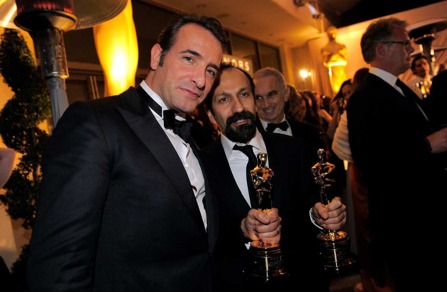 Farhadi, winner for foreign-language film for "A Separation," with the man of the night, lead actor winner Dujardin.