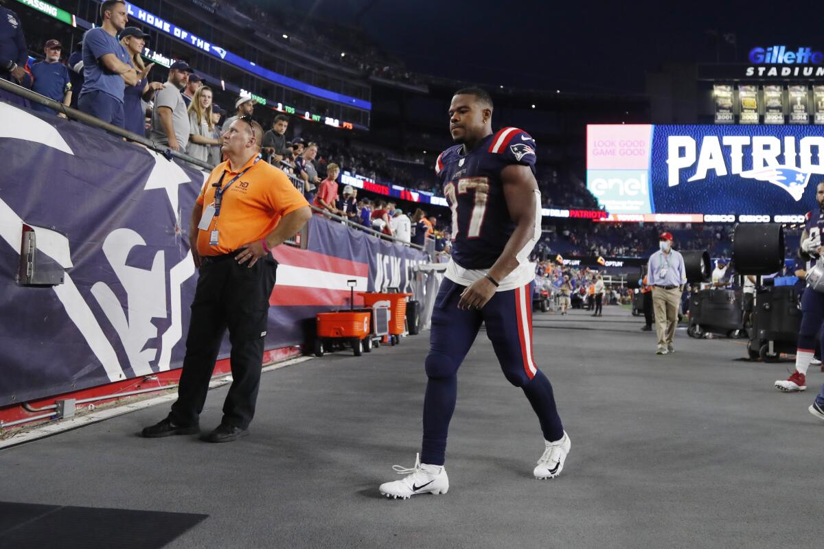 New England Patriots running back Damien Harris heads to the locker room after a loss to the Miami Dolphins in an NFL football game, Sunday, Sept. 12, 2021, in Foxborough, Mass. (AP Photo/Winslow Townson)