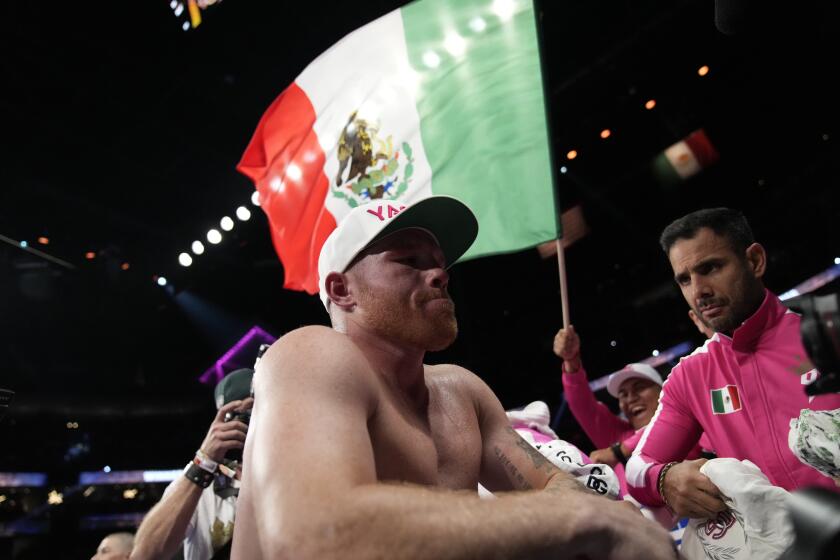 Canelo Alvarez, of Mexico, reacts after losing a light heavyweight title boxing match against Dmitry Bivol, of Kyrgyzstan, Saturday, May 7, 2022, in Las Vegas. (AP Photo/John Locher)