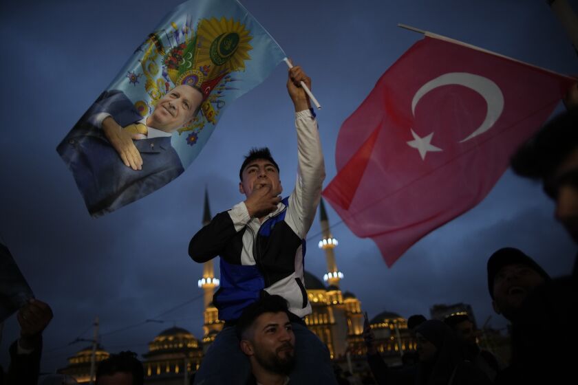 Supporters of the President Recep Tayyip Erdogan celebrate in Istanbul, Turkey, Sunday, May 28, 2023. Turkey's incumbent President Recep Tayyip Erdogan has declared victory in his country's runoff election, extending his rule into a third decade. (AP Photo/Emrah Gurel)