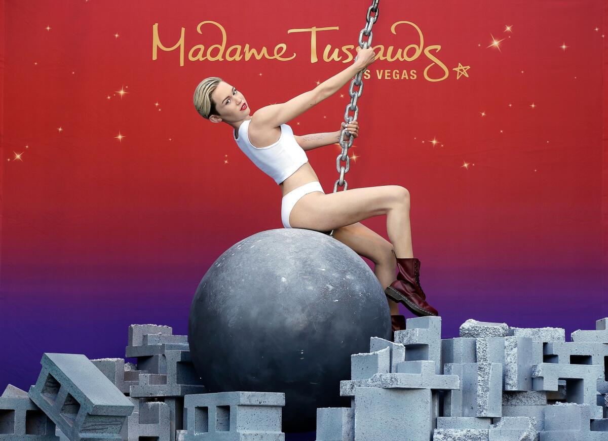 Madame Tussauds debuts a Miley Cyrus wax figure atop a wrecking ball at the Venetian.