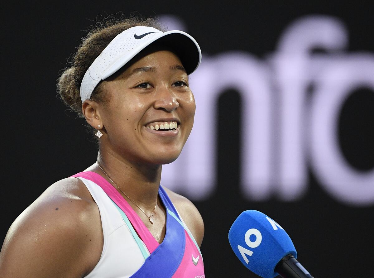 FILE - Naomi Osaka of Japan appears at the Australian Open tennis championships in Melbourne, Australia, on Jan. 19, 2022. The tennis star has a deal with HarperCollins Publishers for a children’s picture book, “The Way Champs Play,” scheduled to come out Dec. 6. (AP Photo/Andy Brownbill, File)