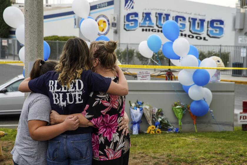 Kent Nishimura  Los Angeles Times Shooting victims mourned Saugus High student Haley Stuart hugs family members at a memorial to the two students killed a day earlier. They were identified as Gracie Anne Muehlberger, 15, and Dominic Blackwell, 14. CALIFORNIA, B1