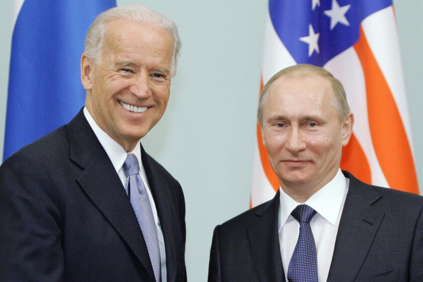 FILE - In this March 10, 2011 file photo, then Vice President Joe Biden, left, shakes hands with Russian Prime Minister Vladimir Putin in Moscow, Russia. The White House and the Kremlin are working to arrange a summit between President Joe Biden and Russian President Vladimir Putin in Switzerland in June. National Security Advisor Jake Sullivan is meeting with his Russian counterpart in the proposed host city of Geneva this week to finalize details. (RIA Novosti, Alexei Druzhinin/Pool via AP, file)