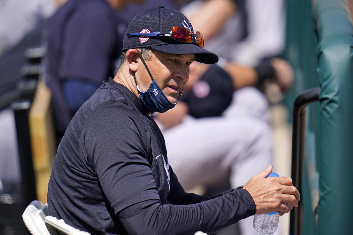 New York Yankees manager Aaron Boone takes a drink of water during a spring training exhibition baseball game against the Detroit Tigers at Joker Marchant Stadium in Lakeland, Fla., Tuesday, March 9, 2021. (AP Photo/Gene J. Puskar