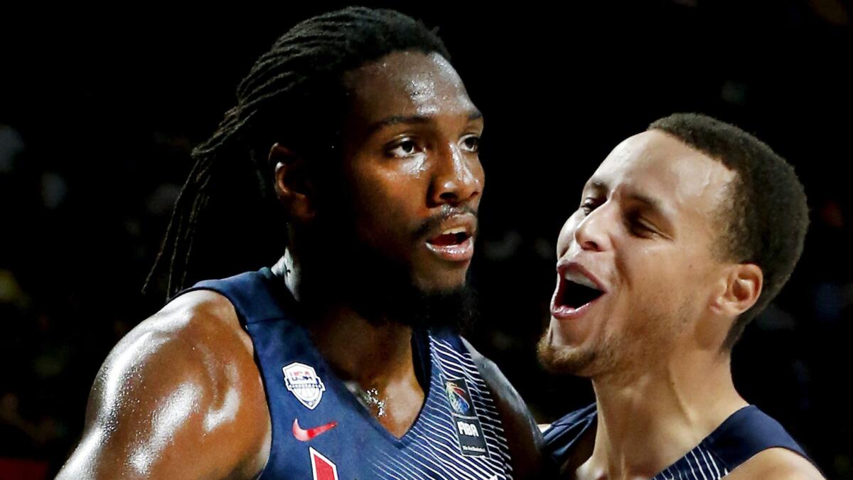 U.S. power forward Kenneth Faried, left, and teammate Stephen Curry celebrate during the USA's Basketball World Cup championship victory over Serbia on Sunday.