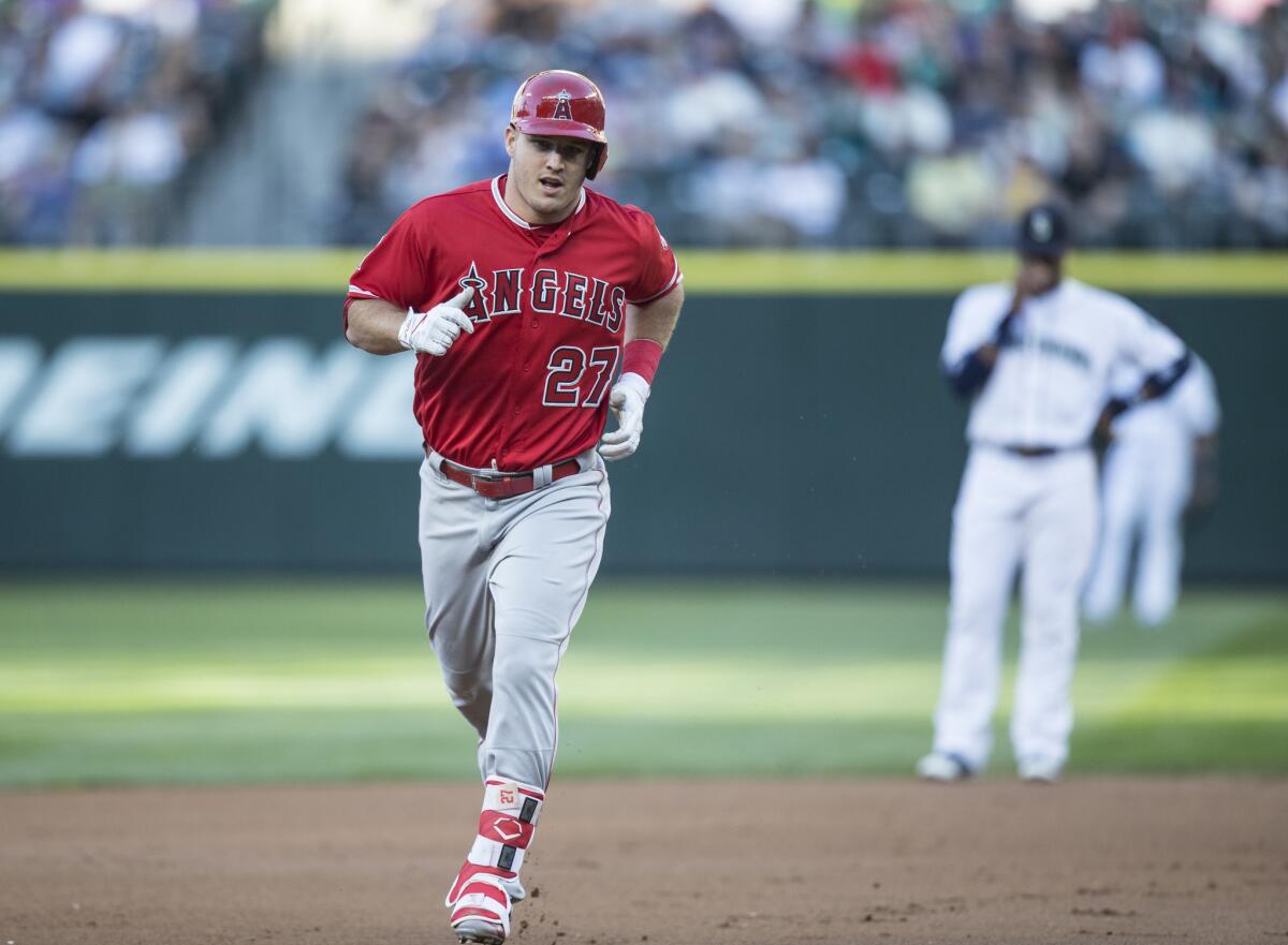 Angels outfielder Mike Trout rounds the bases after hitting a home run during a game against the Seattle Mariners on Sept. 3.