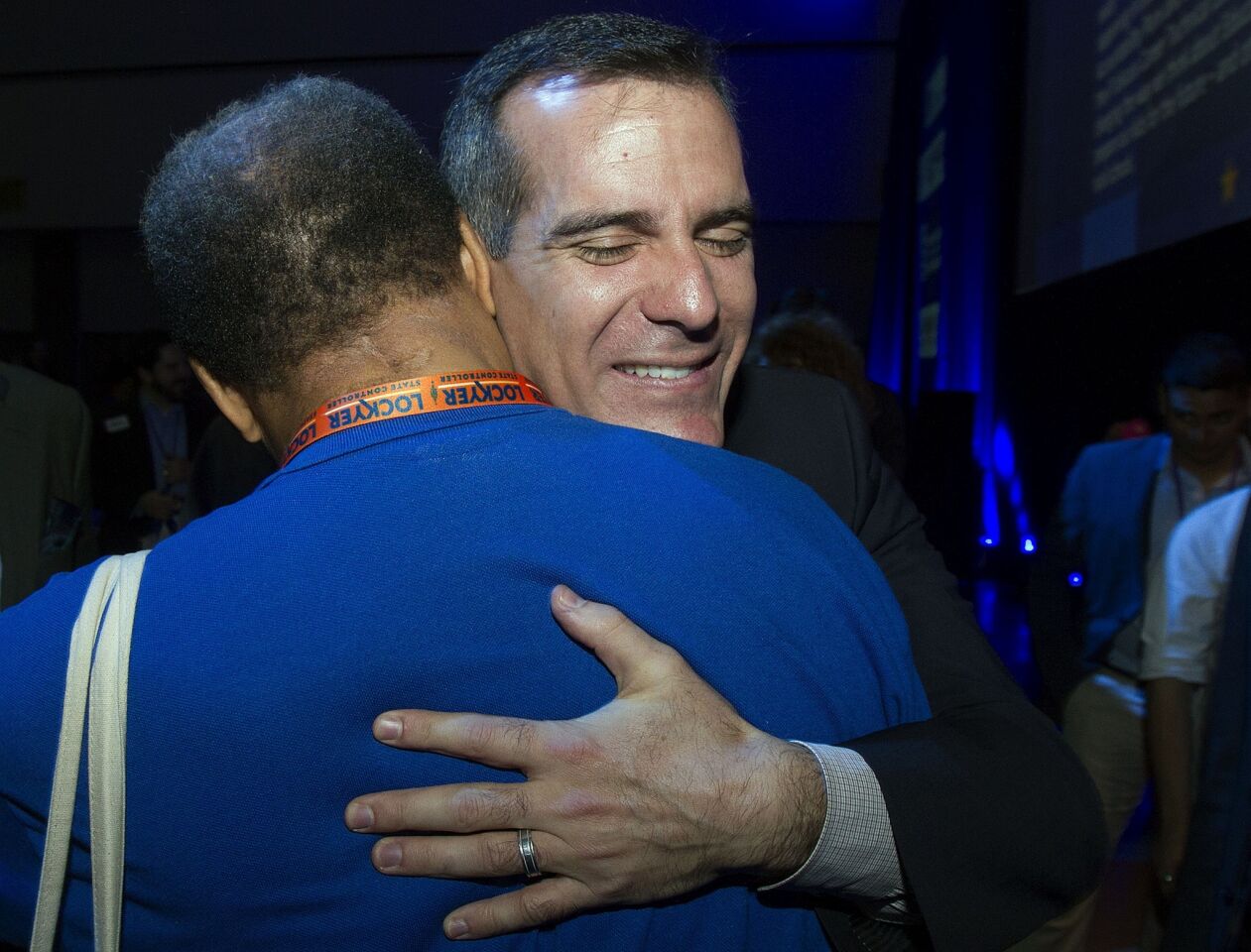 Los Angeles Mayor Eric Garcetti hugs a supporter during the California Democratic Convention.